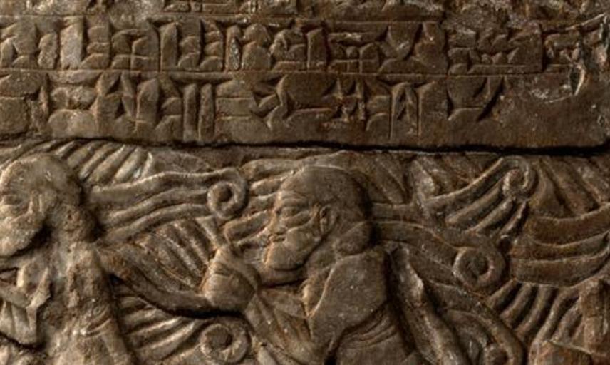 A cuneiform tablet showing ancient script and mounted horsemen.