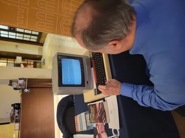 A person using a BBC Micro computer